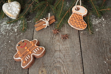 Gingerbread, Christmas ornament, fir tree, snow on wooden background , cinnamon, star anise