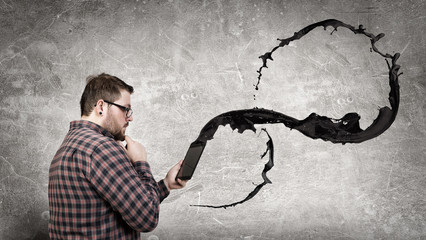 Man using digital tablet . Mixed media