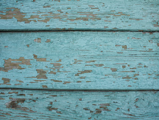 old wooden planks with peeling paint. blue vintage background.