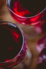 Glass of red wine on wooden table