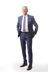 Old businessman portrait.Full length shot of a senior manager standing in suit at isolated white background.