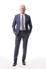 Old businessman portrait.Full length shot of a senior manager standing in suit at isolated white...