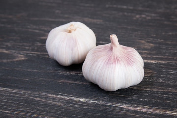 Garlic on a dark wooden background