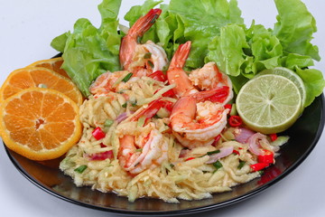 Close up spicy sour minced green mango salad with shrimp. Selective focus.