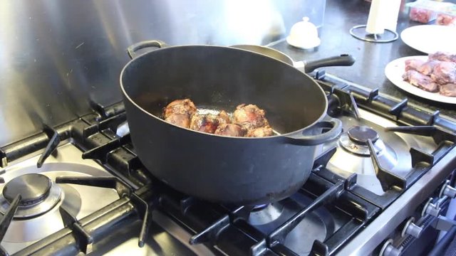 Cooking meat in a pan