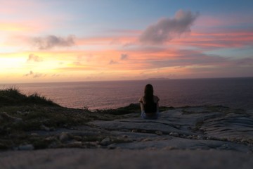 A girl watching a beautiful sunset