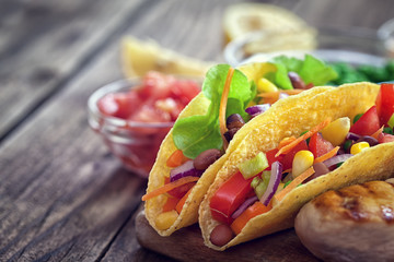 Mexican corn tortilla tacos with vegetables and chicken 