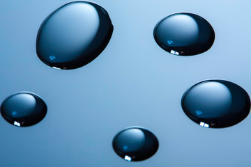 Water drops on gradient background studio shot