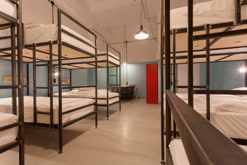 Students bedroom interior. Two levels beds in dormitory room - obrazy, fototapety, plakaty