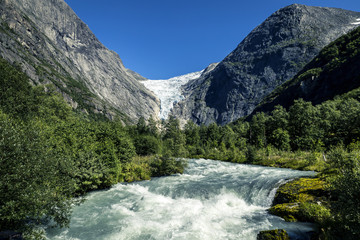 Naklejka na ściany i meble River in mountains of Norway