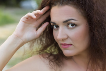 Portrait close up of young beautiful woman, on green background.Soft Focus
