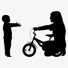 Mom giving son a bicycle silhouette
