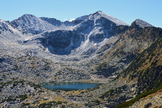 Musala, Rila Mountain, Bulgaria - the highest peak in the Balkan Peninsula. Sunny day. Late autumn. First snow is already fallen. 