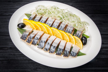 Herring fillets with onion and lemon slices