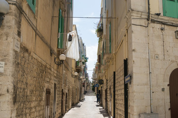 Fototapeta na wymiar Old narrow street in southern Italy 