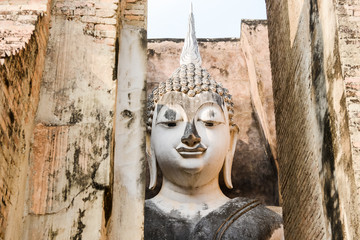 Fototapeta na wymiar Old buddha in the temple at Sukhothai Historical Park in Sukhothai Province, Thailand