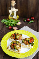 Fragrant Bruschetta with feta cheese, slices of eggplant and broccoli grilled.