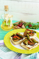Fragrant Bruschetta with feta cheese, slices of eggplant and broccoli grilled.