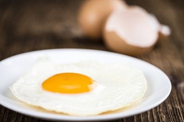 Fried Eggs on wooden background