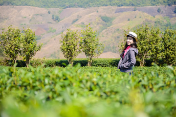 Portrait of happy woman relax in tea plantation