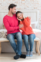 Optimistic bearded man supporting his girlfriend