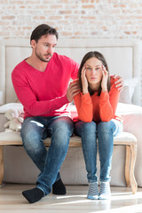 Cheerless young woman suffering from migraine