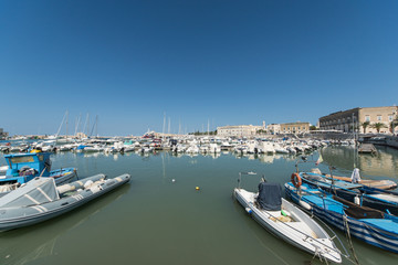 Fototapeta na wymiar Boats moored in port. Trani. Apulia, Italy. 
