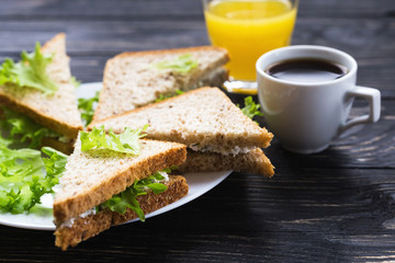 Toasts, cup of coffee and orange juice