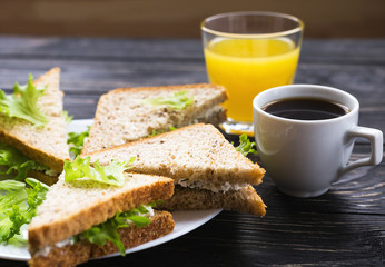 Toasts, cup of coffee and orange juice