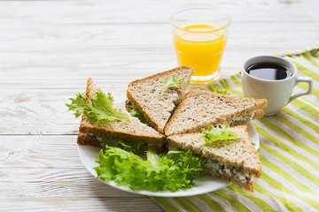 Toasts, cup of coffee and orange juice