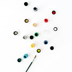 Watercolor and paintbrush on white background. Flat lay, top view