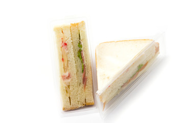 Sandwich in plastic package on white background 