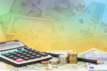 Calculator with coin ,pencil on money banknotes Euro and Dollars