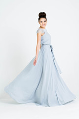 Beautiful woman in Dress. Fashion. Isolated over white.