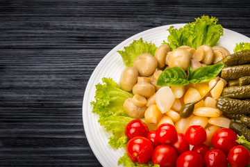 Pickled Vegetables on rustic wooden background