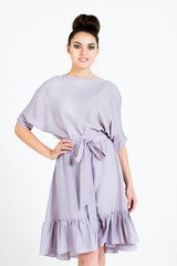 Beautiful woman in Dress. Fashion. Isolated over white.