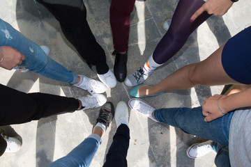 Closeup legs of people wearing classic shoes in a circle