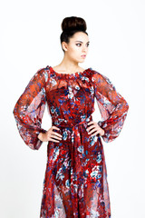 Beautiful woman in Dress. Fashion. Isolated over white.