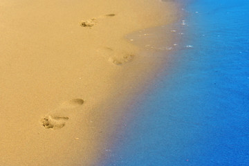 Footprints on sand of sea beach (recreation, tourist, travel, ho