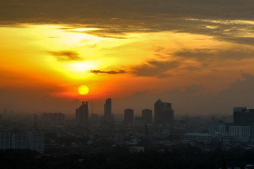 Fototapeta na wymiar Sunrise sunset in the city with selective focus on the sun