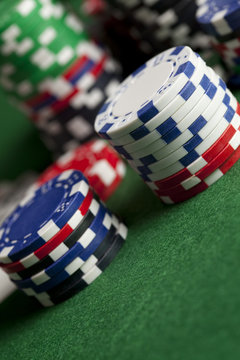 Poker chips on green table