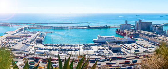 Fototapeta na wymiar Panoramic view of the port in Barcelona, Spain. Cargo port with cars, containers and cargo ships.