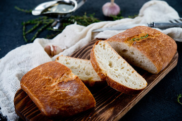 The Italian bread ciabatta with garlic and herbs
