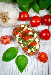 Ciabatta bread with tomatoes, mozzarella and basil.