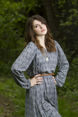 Portrait of beautiful brunette woman in fairy forest