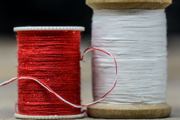 Sewing thread white and red colors