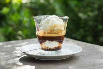 Affogato coffee, espresso shot with vanilla ice cream, backgroun