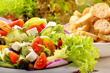 Greek salad with feta cheese black olives and bruscheta