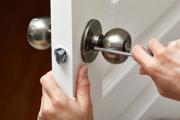 Door knob installation.