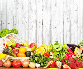 Fototapeta na wymiar Vegetables and fruits over white wall background.
